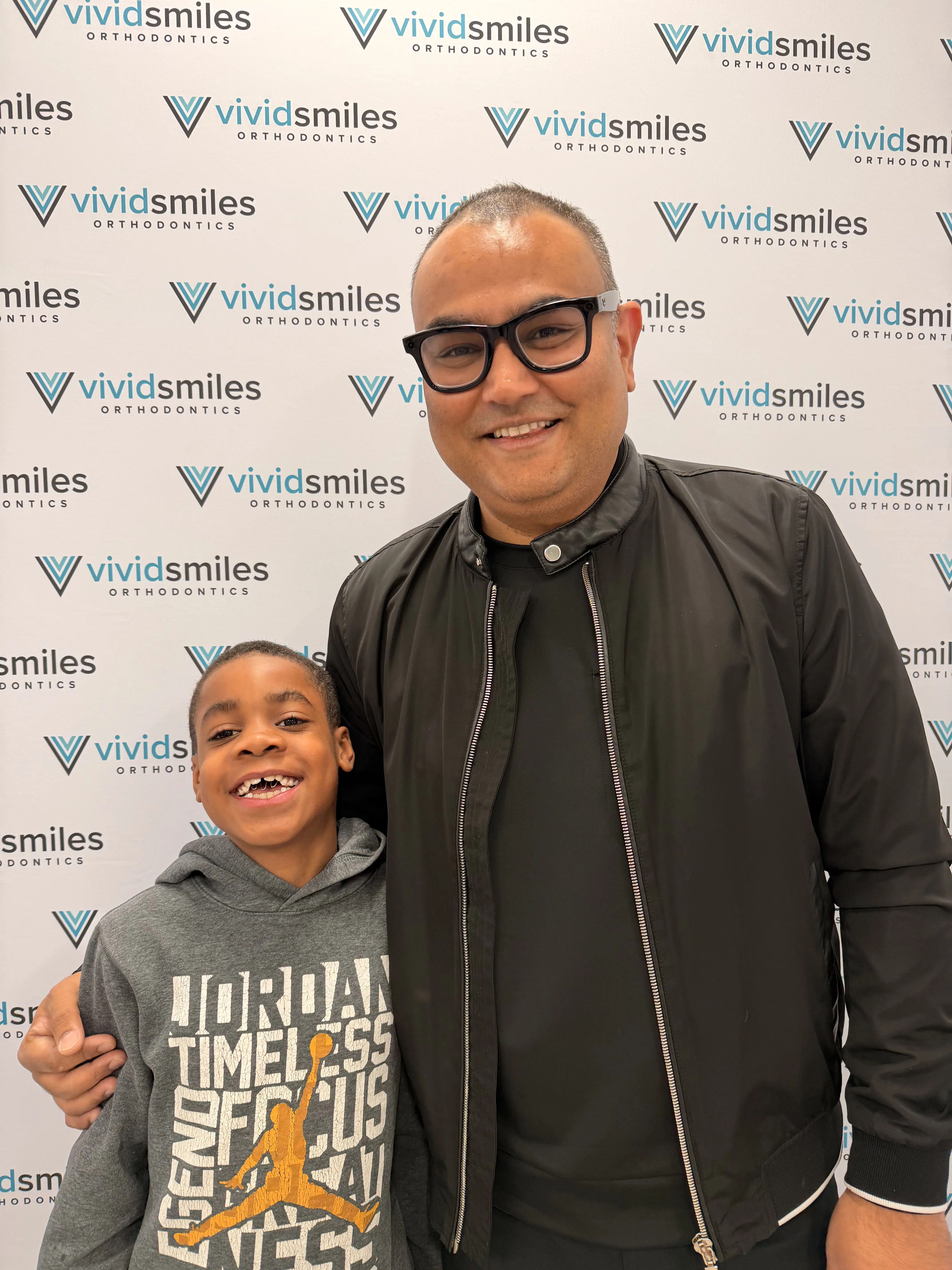 Smiling child wearing braces in a dental office, happy and confident