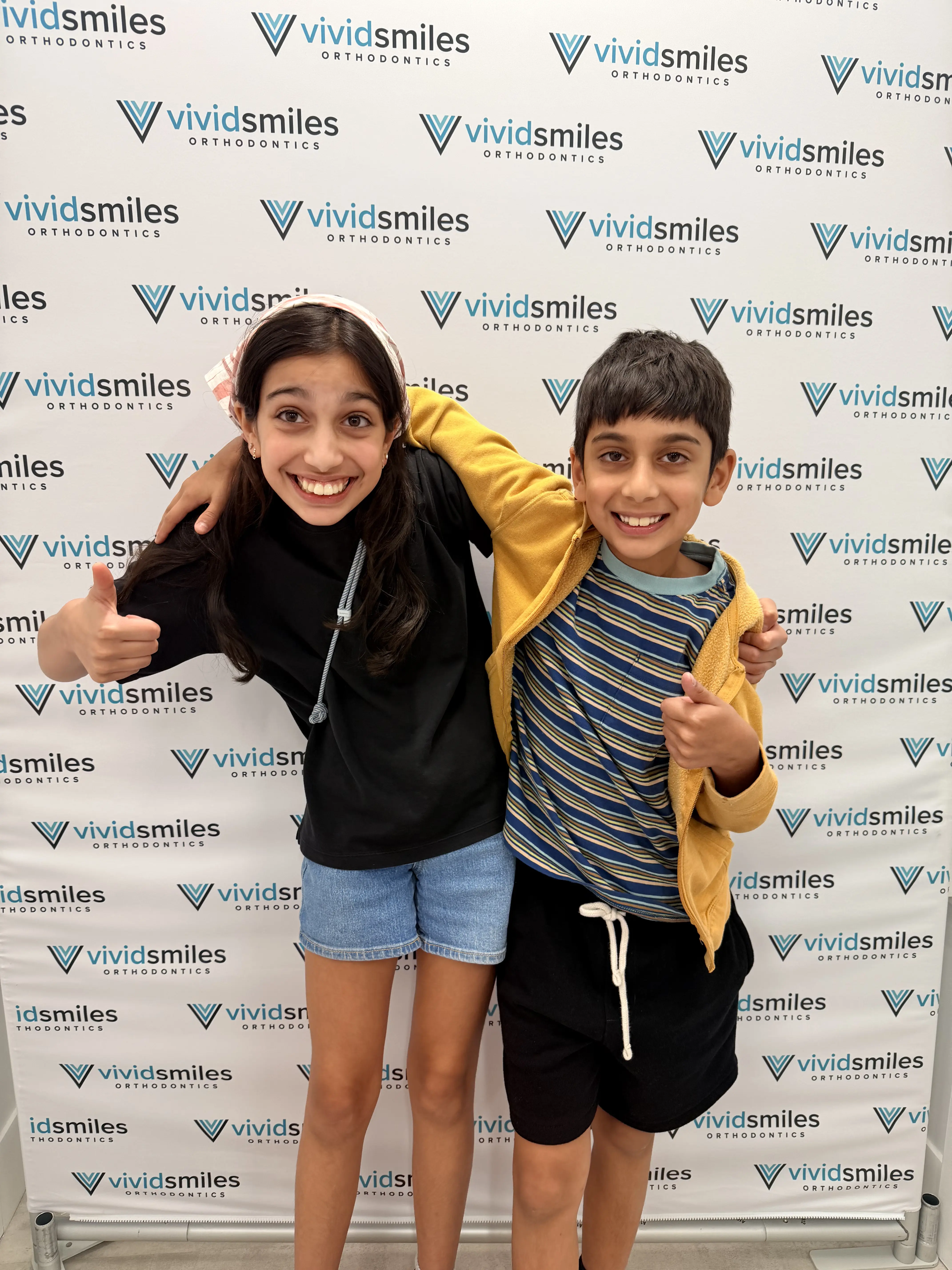 Young Vivid Smiles patient with Dr. Singh at the prize wheel